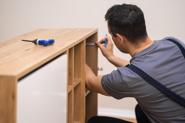 furniture-manufacturing-fixing-carpenter-hands-installing-shelves-wooden-furniture